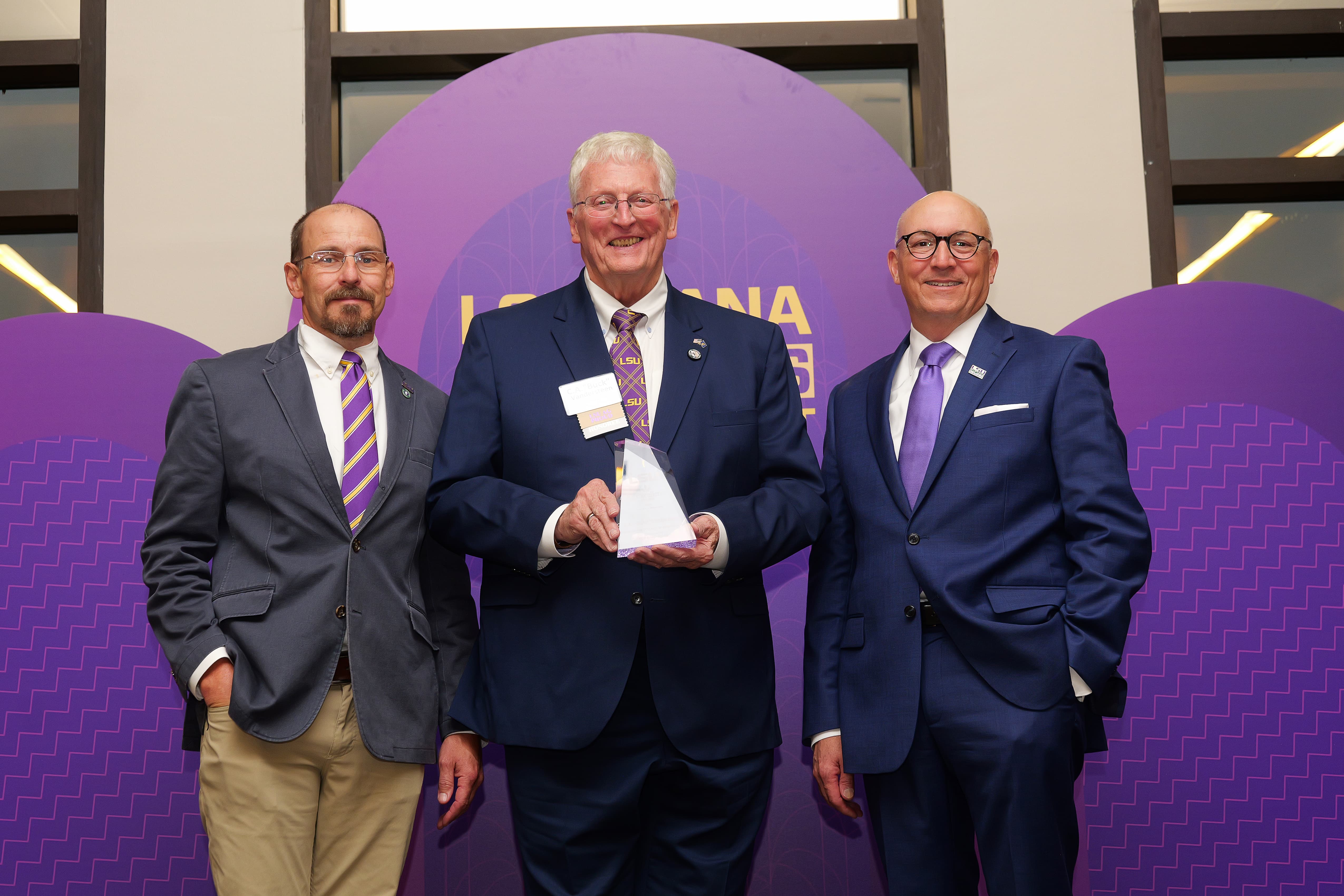 Buck Vandersteen receiving award. 