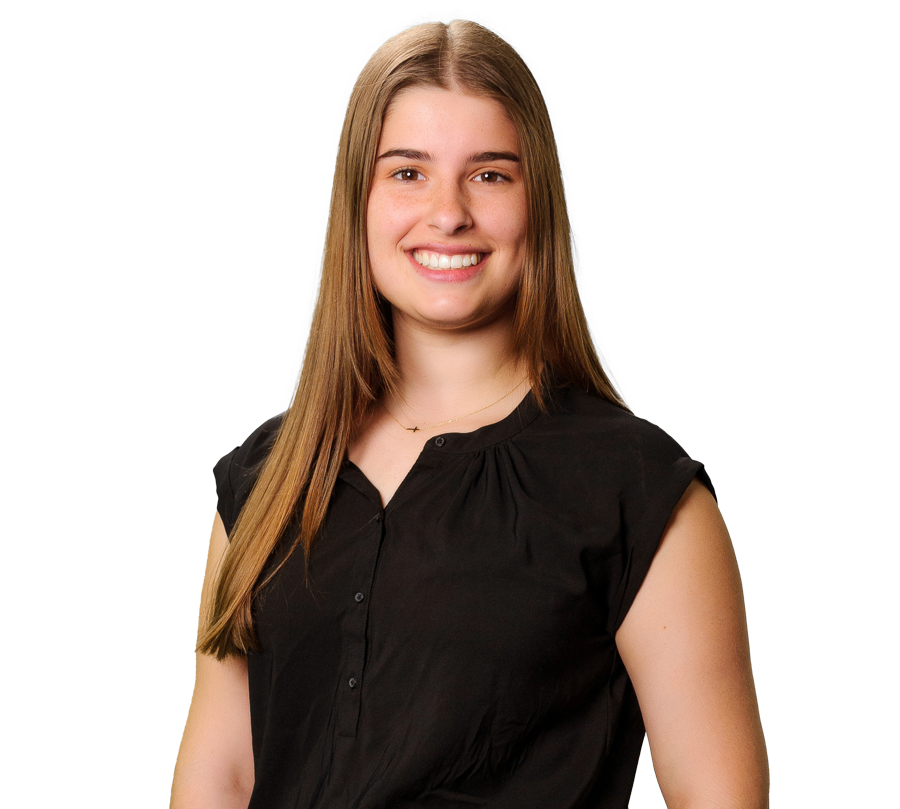 Abigail is in a black shirt smiling for a photo