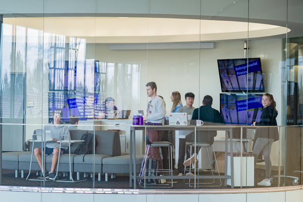 A group of students work on a project in the Ideation Lab on the LSU Business Education Complex's third floor.