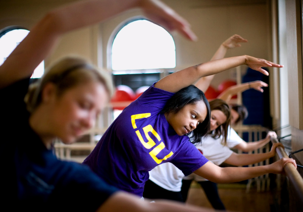 Students doing yoga.