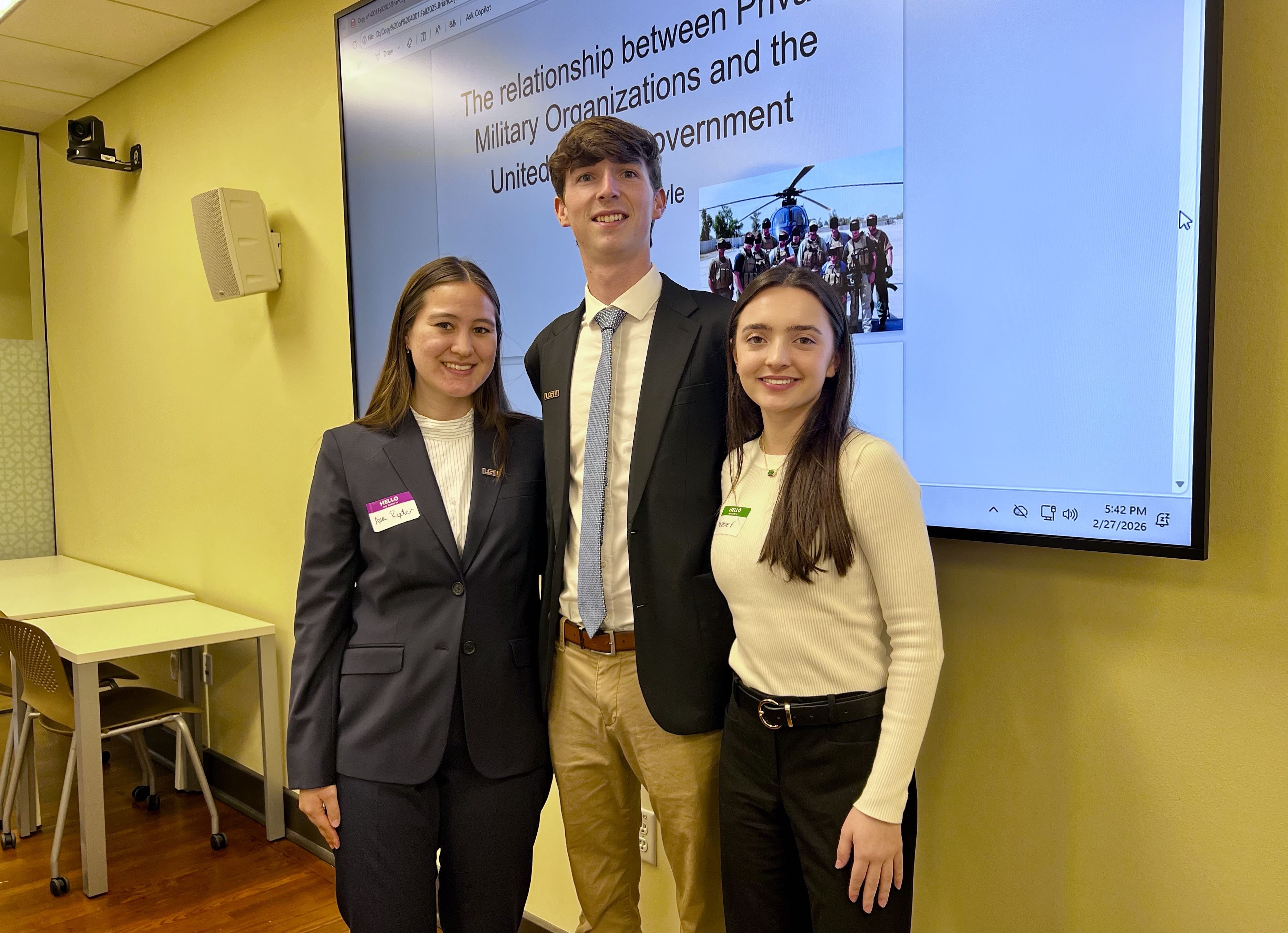 International Studies students Ava Ryder Brian Coyle and Madeleine Fitkin presenting at 2026 LSU HGSA Conference