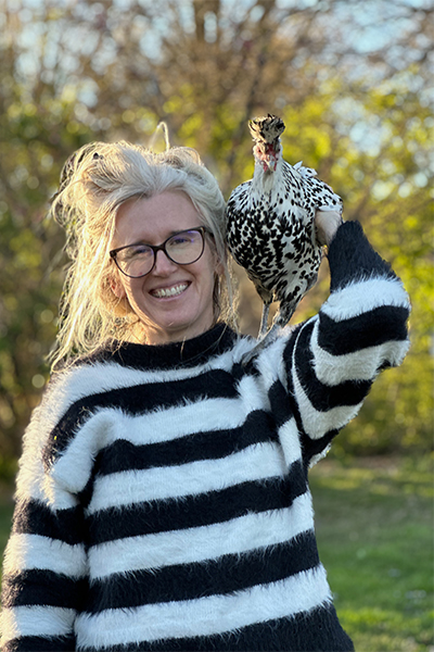 Emily Bivens with a chicken on her shoulder