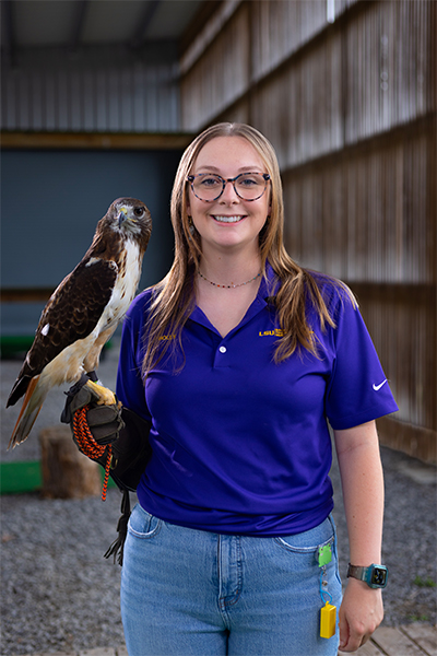 Holly Casper with red-tailed hawk