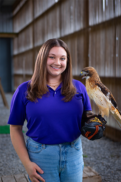 Anne-Marie Elser with red-tailed hawk