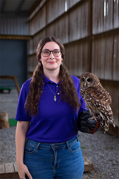 Emily Halphen with a barred owl