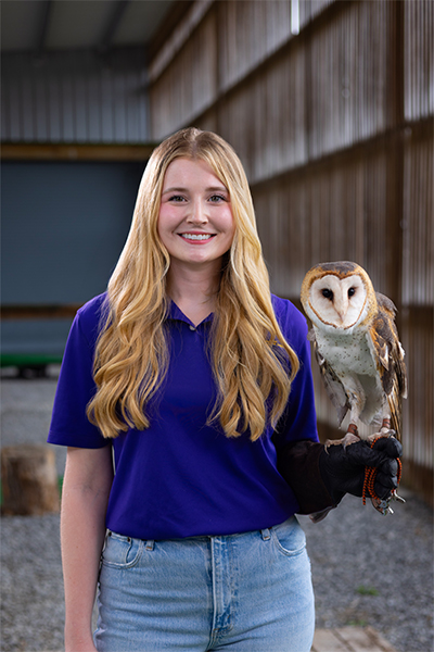 Caitlin Watford with a barn owl